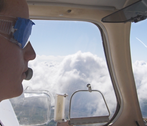 Picture of Jacob Fliginger near clouds.