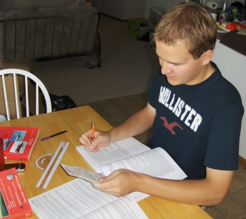 Picture of Jacob Fliginger studying for his Private Pilot license.